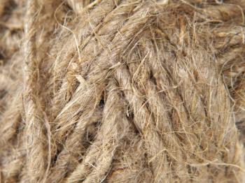 Clew of twine taken closeup as abstract background.