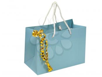 Blue gift bag with golden decorative tape isolated on white background.