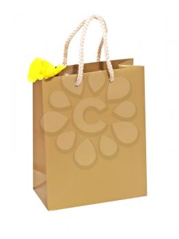 Birthday gift bag with yellow flower isolated on a white background.