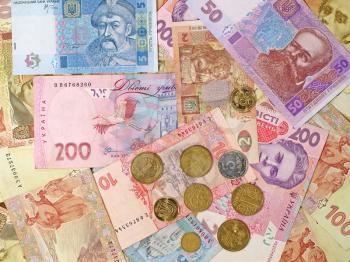 Ukrainian banknotes and coins suitable as background.