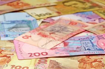 Ukrainian money hryvnia closeup as background.