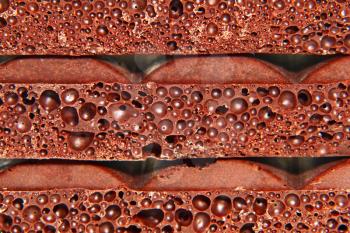 Porous chocolate taken closeup as abstract background.