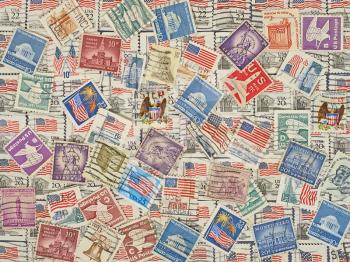 Different postage stamps as background