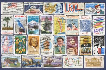 Set of different USA postage stamps suitable as background.