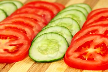 Slices of tomatoes and cucumbers. 