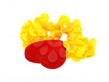 Red heart and yellow flower isolated on a white background.