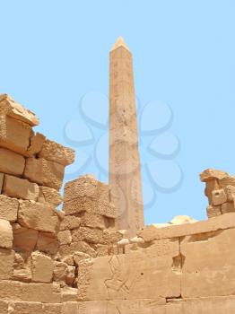Obelisk on  blue sky background in the Karnak temple.

