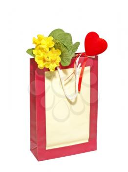 A Valentines Day holiday gift bag with red heart and flowers isolated on a white background.