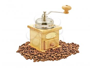 Manual coffee grinder and coffee beans isolated on a white background.