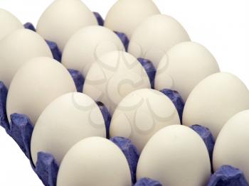 A dozen fresh eggs arranged in a row in the pot.