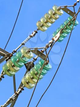 High voltage electrical insulator electric line against the  blue sky.