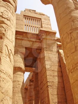 Columns in the Karnak temple with ancient images.