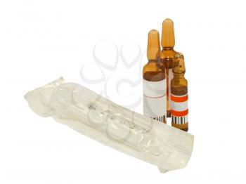 Disposable syringes and ampoules on a white background.