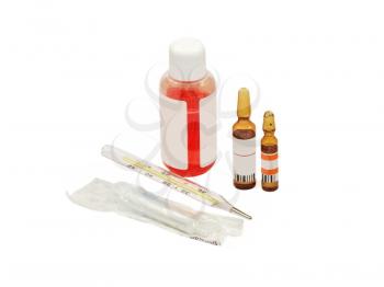 Disposable syringe, thermometer and ampoules on a white background.