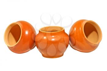 Three clay pot isolated on a white background.