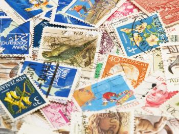 Postage stamps of different countries and times.Background