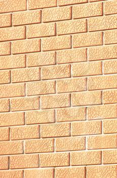 The walls of orange bricks of the same size.