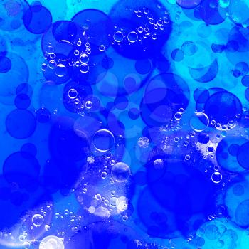 Blue and turquoise bubble bokeh abstract background.