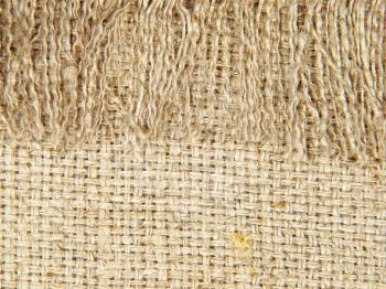 Natural linen texture with fringe suitable as abstract background.