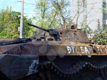 MARIUPOL,UKRAINE-MAY 09,2014:Destroyed armored car on Mariupol street taken closeup after armed conflict.