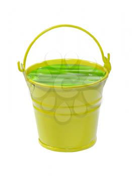 Yellow bucket with green poisonous liquid isolated on white background.