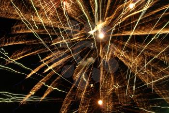 Golden Fireworks Bursts in a Darkness as Abstract Background.