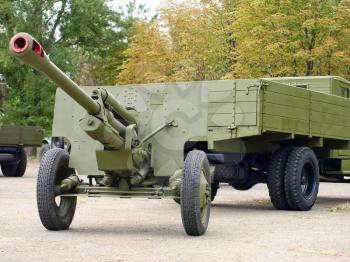 MARIUPOL, UKRAINE-SEPT 9:Soviet 76mm cannon gan ZiS3 and army truck ZiS5,(Ural), historical reenactment of WWII, September 9, 2013 in Mariupol,Ukraine