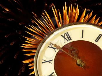 Dial of hours on a golden firework in darkness background.Eve of new year.