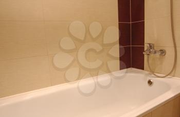 Bath tub detail with chrome faucet.