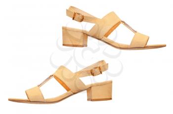 The pair of beige woman sandals isolated on white background.
