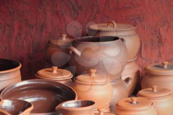 Different kinds of ceramics pots for sale taken closeup.