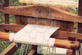 Retro weaving loom taken closeup.Toned image.