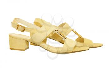 Pair of beige woman sandals isolated on white background.