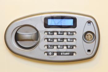 Control panel of electronic home safe with open sign.