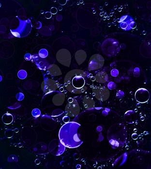 Abstract purple bubbles and blurry background.