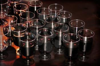 Red wine in glasses on holiday reception table at nightclub taken closeup.Toned image.