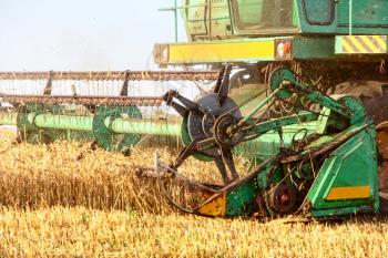 Combine harvester machine in agriculture field taken closeup.