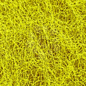 Yellow weaved and porous texture as abstract background.