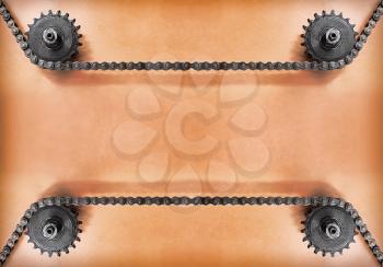 Metal cogwheels and double chain on grunge background with empty space for text.Technology background.