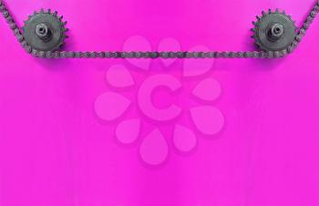 Black Metal cogwheels and chain on purple background with empty space for text.