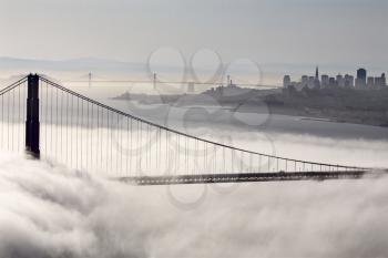San Francisco Skyline fog rolling in morning sunrise
