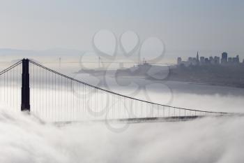 San Francisco Skyline fog rolling in morning sunrise