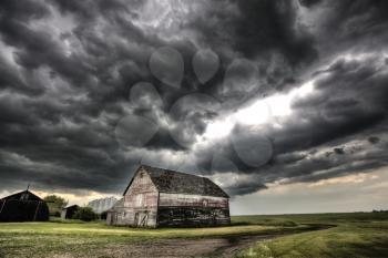 Storm Clouds Saskatchewan old farm and darkened skies