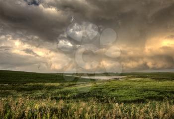 Storm Clouds Saskatchewan sunset over prairie field