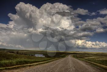 Storm Clouds Saskatchewan billowing clouds and gravel road