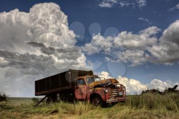 Storm Clouds Saskatchewan with antique abandoned truck