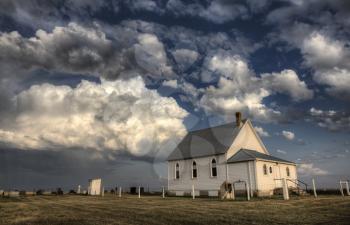 Storm Clouds Saskatchewan with country church at sunset