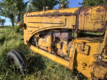 Old Vintage Farm tractor Saskatchewan Canada yellow
