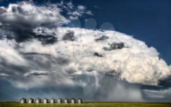 Prairie Road Storm Clouds Saskatchewan Canada field metal granaries