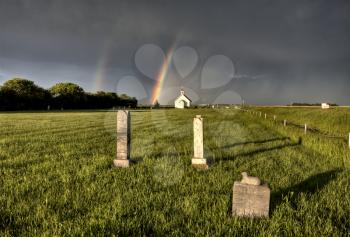 Old Country Church in Saskatchewan Canada with storm clouds rainbow